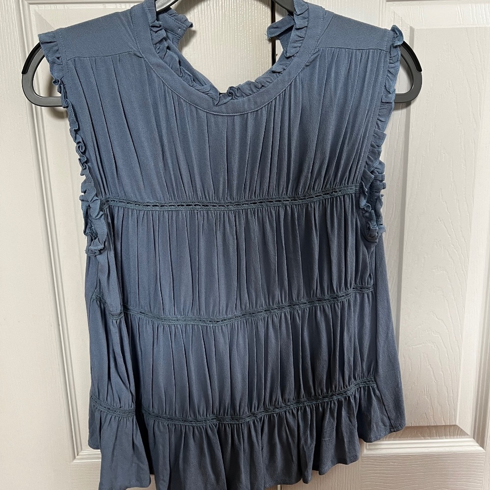 Blue sleeveless blouse